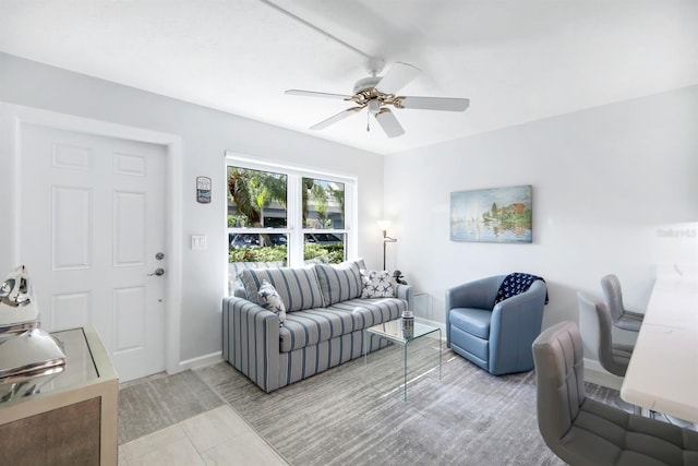 tiled living room featuring ceiling fan