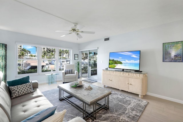 living room featuring hardwood / wood-style flooring and ceiling fan