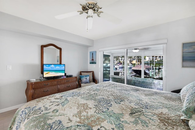 bedroom featuring hardwood / wood-style flooring, ceiling fan, and access to exterior