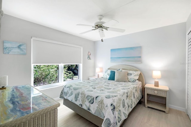 bedroom featuring ceiling fan and light hardwood / wood-style floors