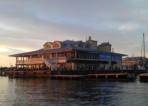 back house at dusk with a water view