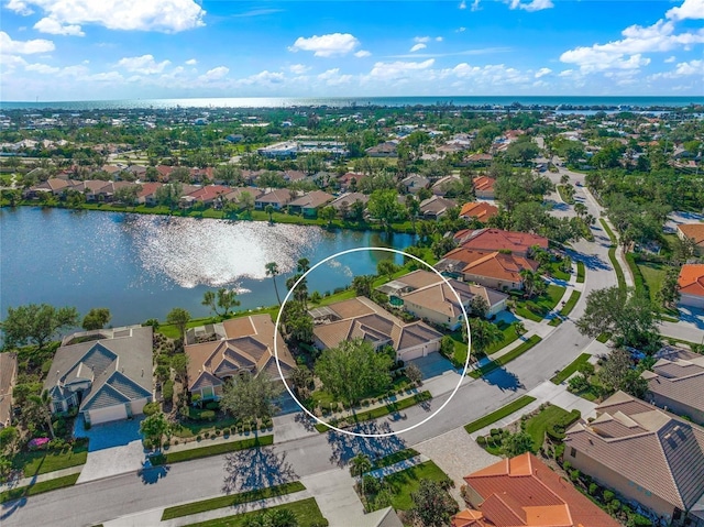 birds eye view of property with a water view