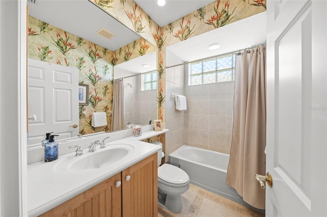 full bathroom featuring tile patterned floors, vanity, toilet, and shower / tub combo