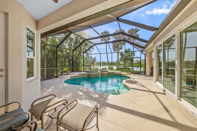 view of pool with an in ground hot tub, glass enclosure, and a patio area