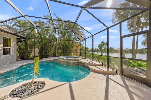 view of pool featuring an in ground hot tub, a water view, and glass enclosure