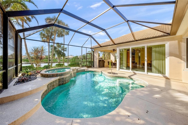 view of swimming pool featuring a lanai, an in ground hot tub, and a patio