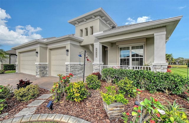 view of front of house with a porch and a garage