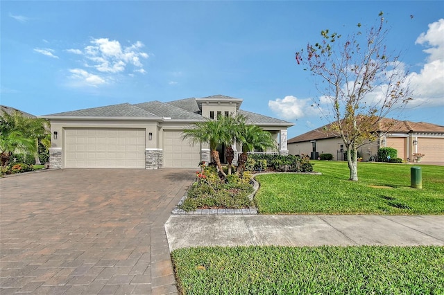 view of front of house with a front lawn and a garage