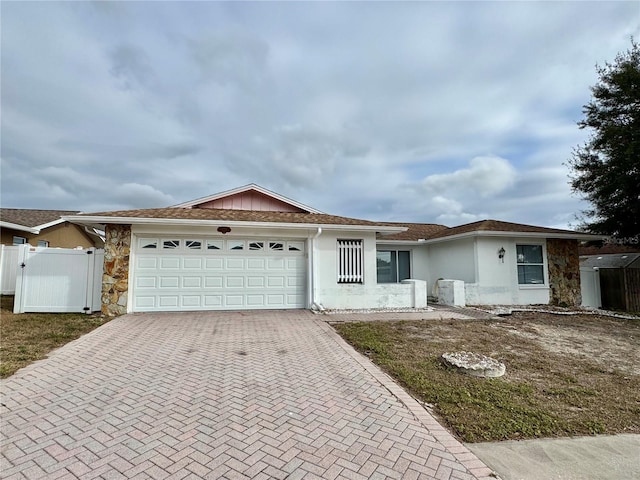 single story home featuring a garage