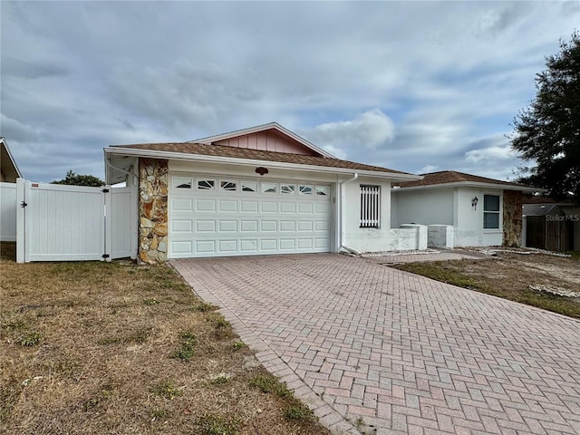 single story home featuring a garage