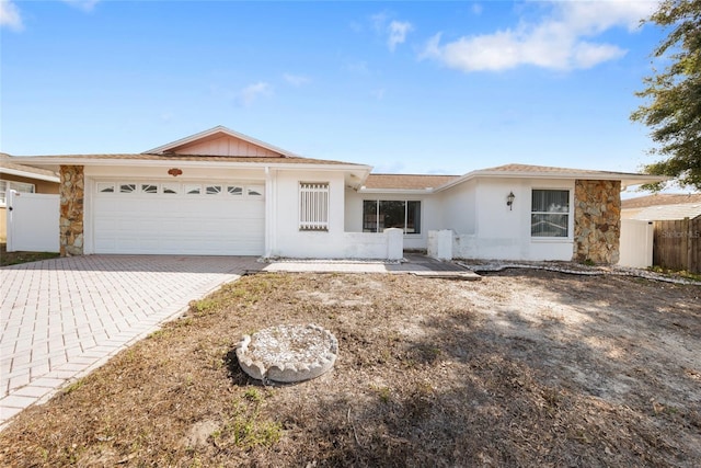 ranch-style home featuring a garage