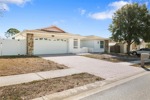 ranch-style house featuring a garage