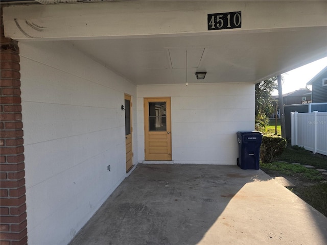 entrance to property featuring a carport