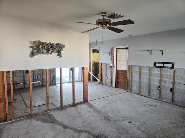 spare room with concrete flooring and ceiling fan