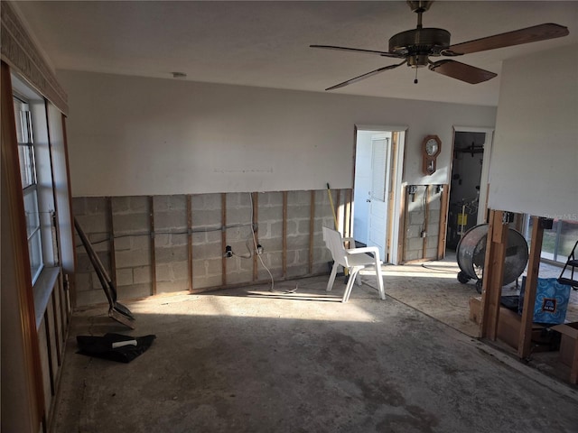 interior space featuring ceiling fan