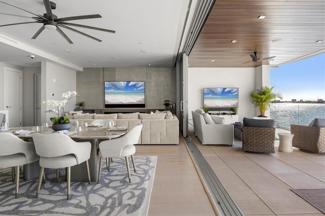 dining space with light hardwood / wood-style floors, expansive windows, and wood ceiling