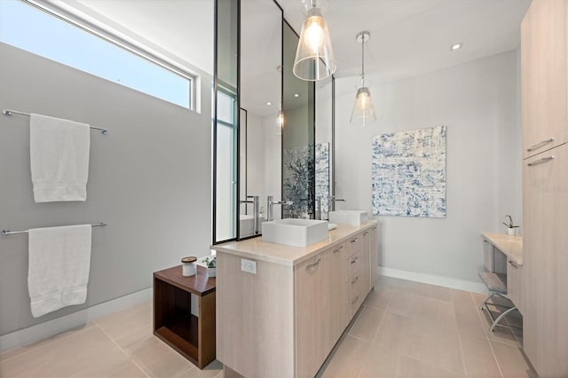 bathroom with tile patterned floors and vanity