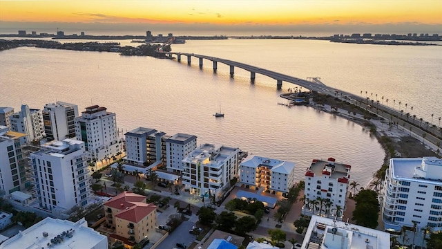 aerial view at dusk with a water view