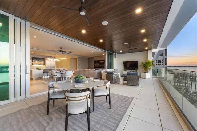 tiled dining space featuring a wall of windows and wood ceiling