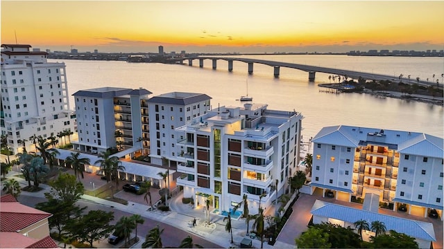 aerial view at dusk with a water view