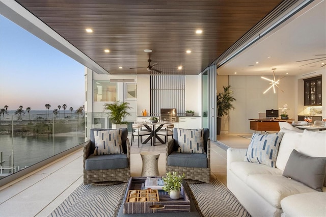 interior space featuring ceiling fan with notable chandelier, a water view, and wood ceiling