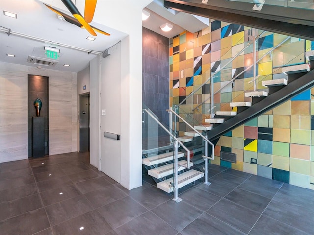 stairs with tile patterned flooring