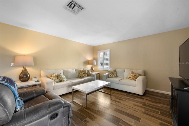 living room with baseboards, visible vents, and wood tiled floor