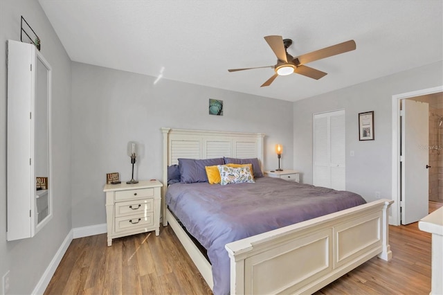 bedroom with ceiling fan, a closet, and light hardwood / wood-style flooring