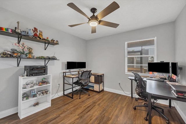 office with ceiling fan and dark wood-type flooring