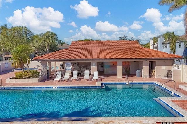 view of swimming pool with a patio