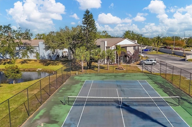 view of sport court featuring a water view