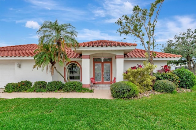 mediterranean / spanish house featuring french doors and a front yard