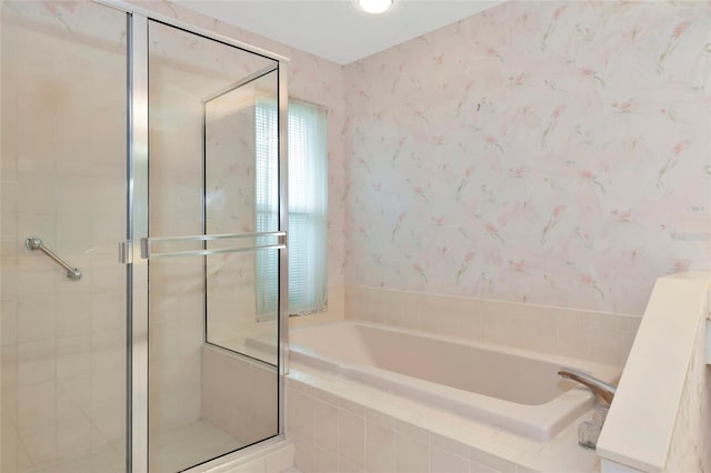 bathroom featuring separate shower and tub