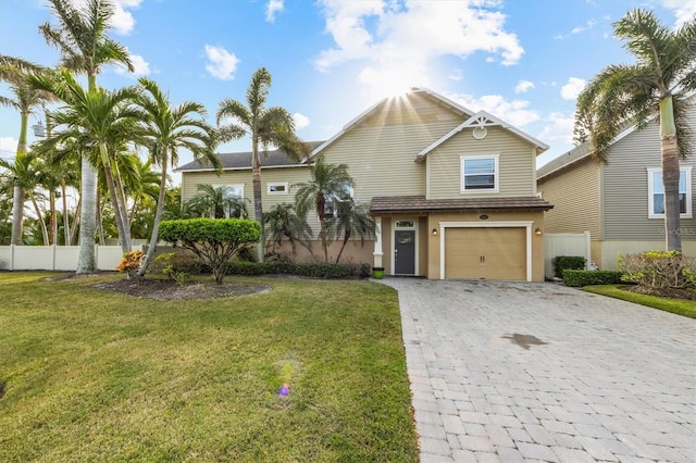 view of front facade with a front yard and a garage