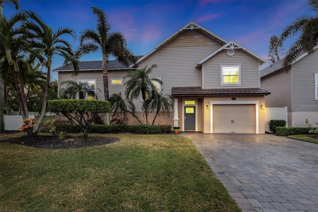 view of front of house with a lawn and a garage