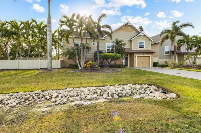 view of front facade with a front yard and a garage