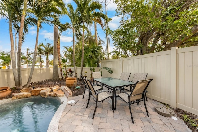 view of patio featuring a fenced in pool