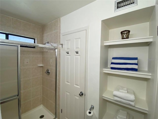 bathroom featuring walk in shower