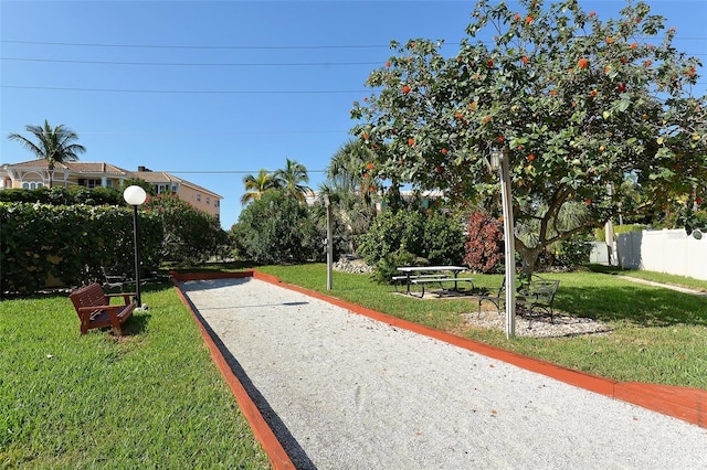 view of home's community with a lawn