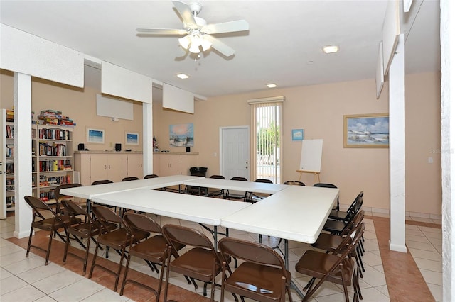 tiled dining space featuring ceiling fan