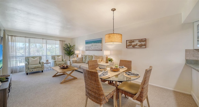 dining room with light carpet