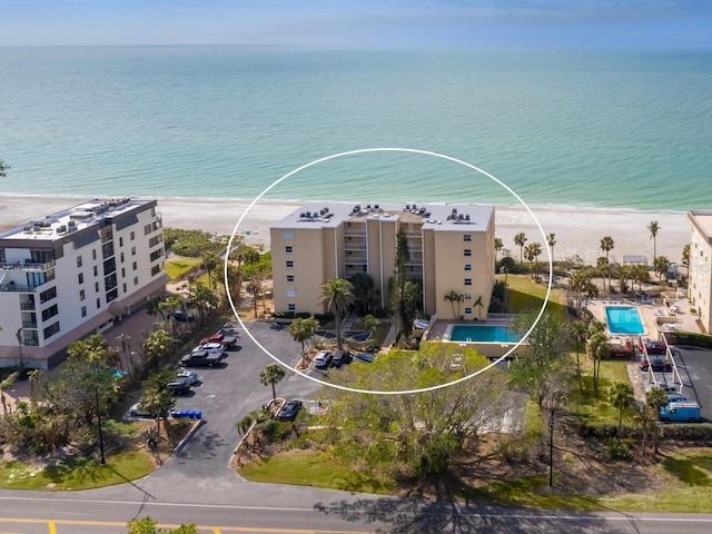 bird's eye view with a beach view and a water view