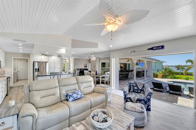 living room featuring ceiling fan, light hardwood / wood-style floors, lofted ceiling, and wooden ceiling