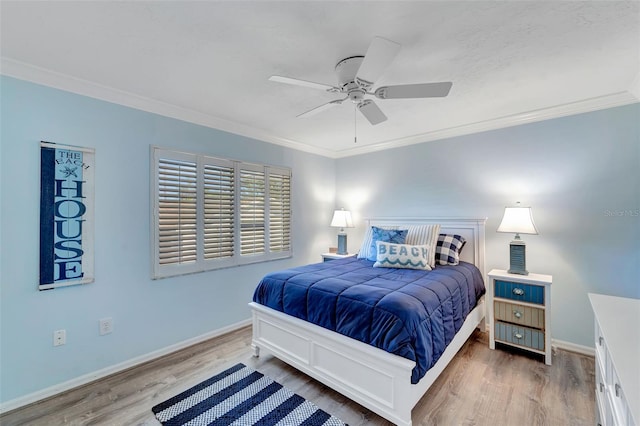 bedroom featuring ceiling fan, crown molding, and wood-type flooring