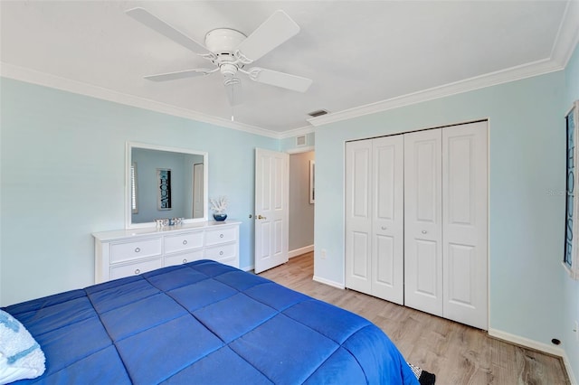 unfurnished bedroom featuring light hardwood / wood-style floors, a closet, ornamental molding, and ceiling fan