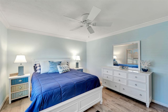 bedroom featuring ceiling fan, crown molding, and light wood-type flooring