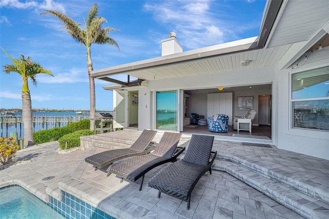 view of patio with a water view