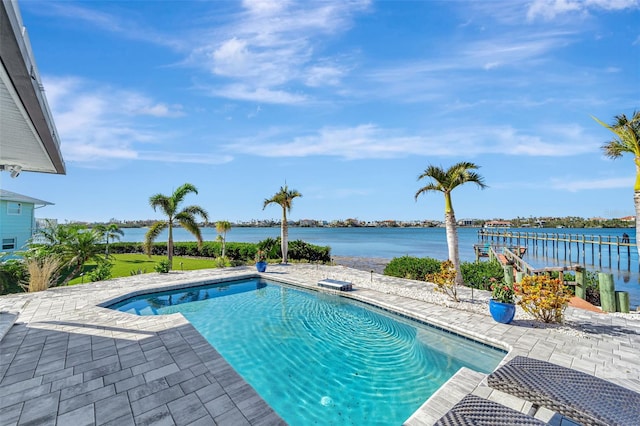 view of pool featuring a water view and a patio area