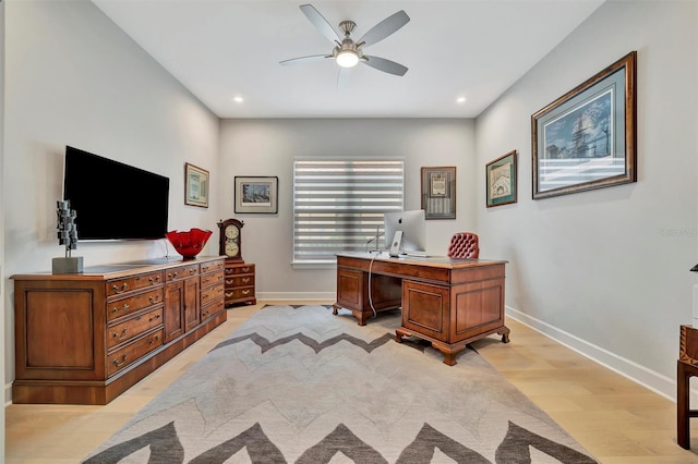 office space featuring light wood-type flooring and ceiling fan