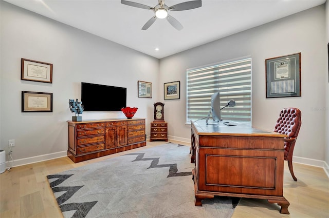 office area with ceiling fan and light hardwood / wood-style flooring